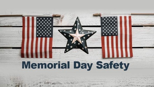 Memorial Day Safety, with two American Flags and a star in the distance.