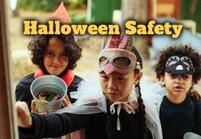 Halloween Safety text. Three children in costumes.