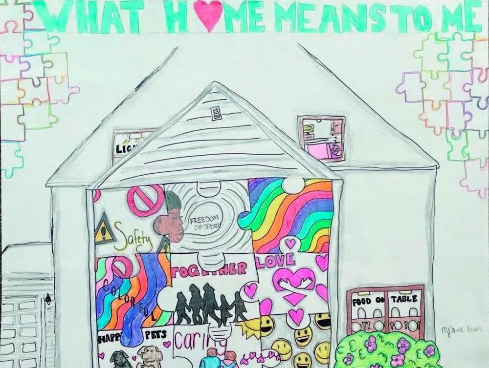 What Home Means to Me April 2024 Winner. A house filled with puzzle pieces with various picture of the meanings of what home means to the artist.