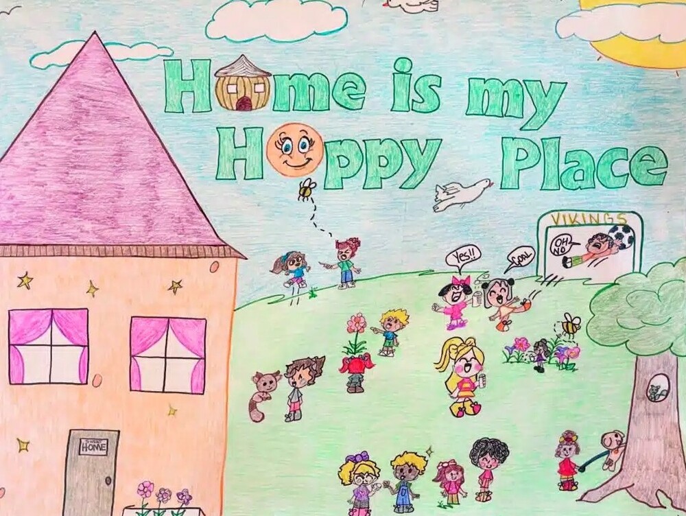 What Home Means to Me Poster Contest Winner, August 2024. Home is my Happy Place. A large group of children inbetween a house and a tree with a squirrel in it playing and happy..