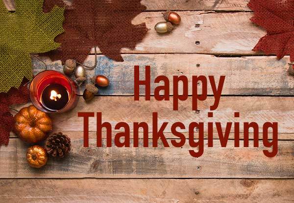 Happy Thanksgiving. Leaves and acorns on a piece of wood.